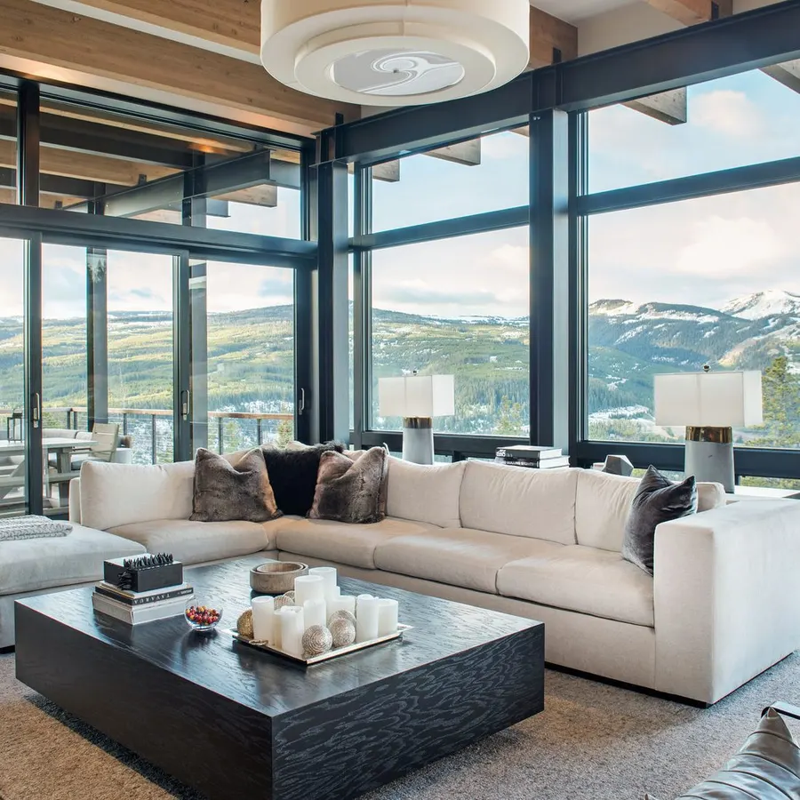 Untinted living room windows with heavy afternoon glare on a Utah mountain view